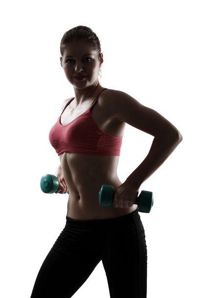 Sport woman doing exercise with dumbbells - Фото, изображение