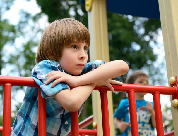 Boy playing on playground - Valokuva, kuva