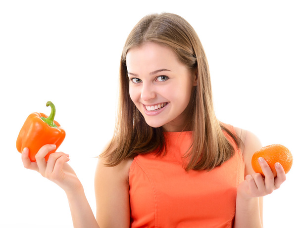 woman holding  pepper and mandarin - Фото, зображення