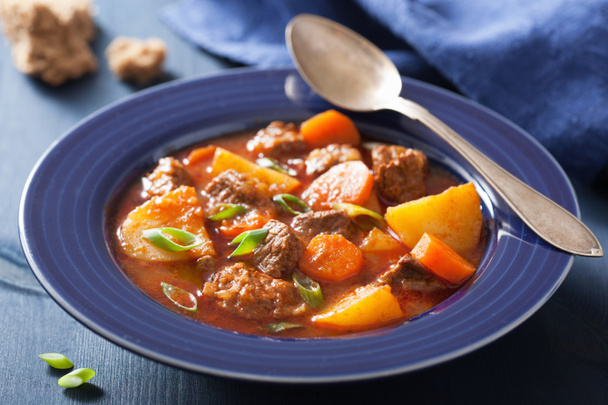 beef stew with potato and carrot in blue plate - Photo, Image