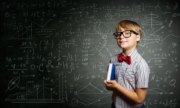 Genius boy near blackboard with formulas - Zdjęcie, obraz