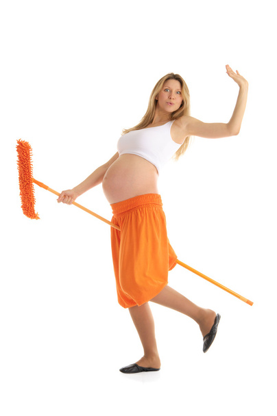 Happy pregnant woman with a mop - Photo, image
