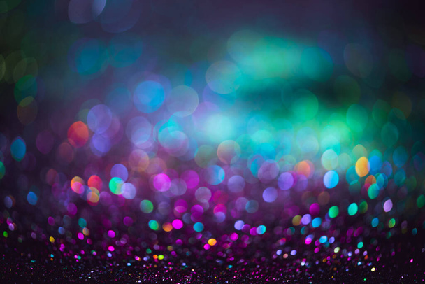 bokeh effect glitter colorful blurred abstract background for birthday, anniversary, wedding, new year eve or Christmas. - Photo, image