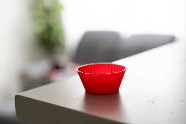 Red silicone cake pan on a table - Photo, Image