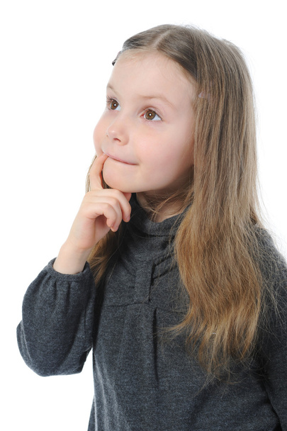 Portrait of a pensive little beautiful girl - Фото, изображение