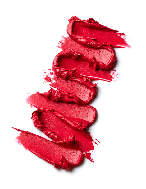 Farbtupfer von rotem Lippenstift auf weißem Hintergrund - Foto, Bild