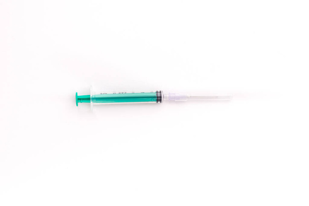 Plastic Syringe isolated stock image on texture background. - Foto, Bild