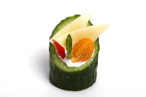 A closeup shot of delicious cucumber canape with feta cheese isolated on white background - Φωτογραφία, εικόνα