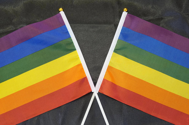 Two LGBT Pride flags isolated on a black background - Fotografie, Obrázek
