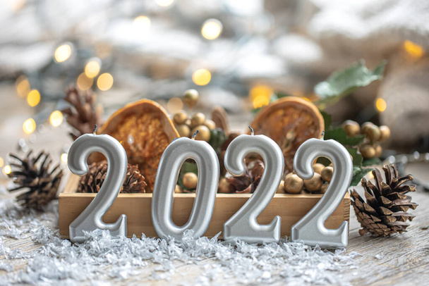 Festive New Year background with candles in the form of the numbers 2022. - Photo, Image