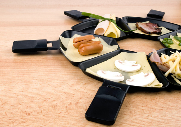 Raclette pans with food, ideal for party - Photo, Image