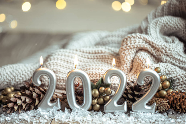 Festive New Year background with candles in the form of the numbers 2022. - Foto, immagini