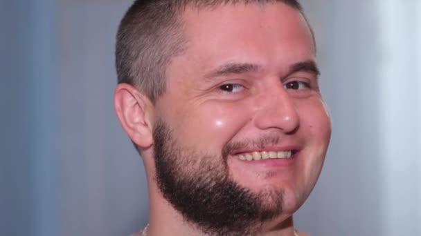 Portrait of happy man with half shaved face beard hair.  - Footage, Video