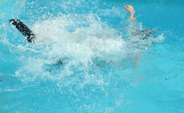 Jumping child in swimming pool  - Foto, immagini