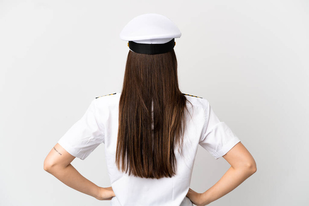Brazylijska dziewczyna Samolot pilot na izolowanym białym tle w tylnej pozycji - Zdjęcie, obraz