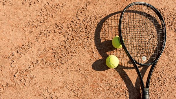tennis balls black racket. High quality photo - 写真・画像