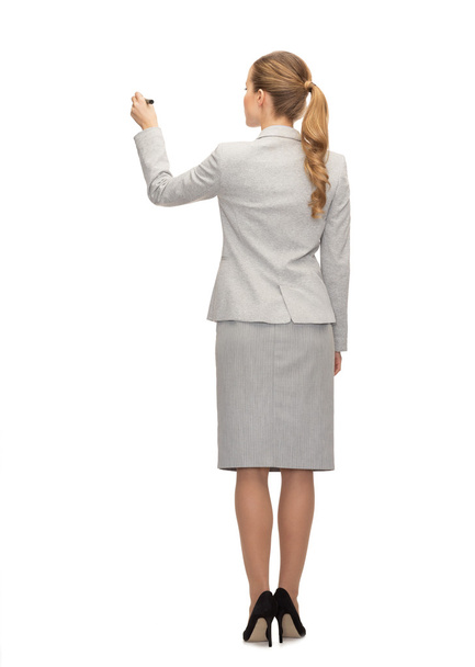 businesswoman or teacher with marker from back - 写真・画像
