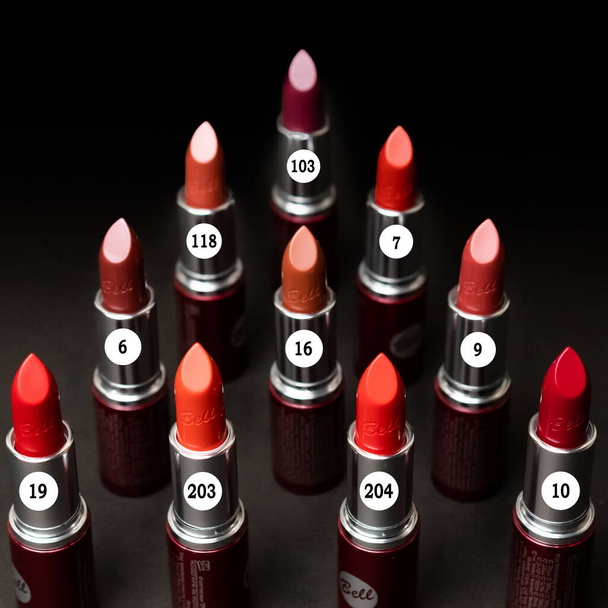 Lipstick. Fashion Colorful Lipsticks over black background. Lipstick tints palette, Professional Makeup and Beauty. Beautiful Make-up concept - Photo, Image