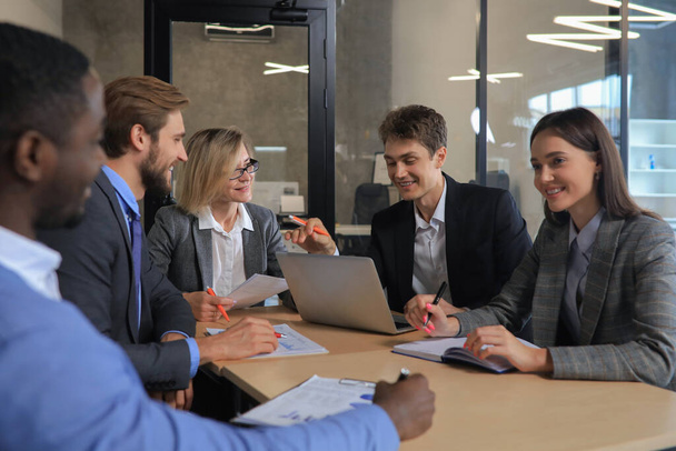 Group of happy young business people in a meeting at office - Fotoğraf, Görsel