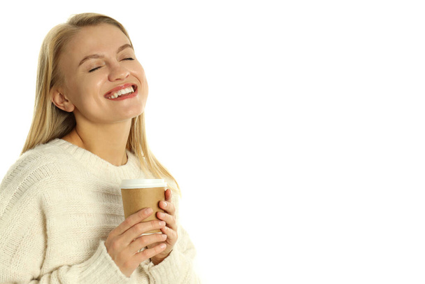 Attractive woman with paper cup isolated on white background. - 写真・画像
