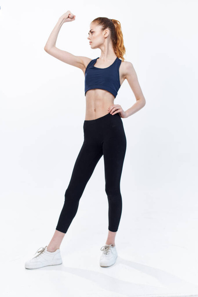sportive woman cardio workout exercise posing light background - Photo, Image