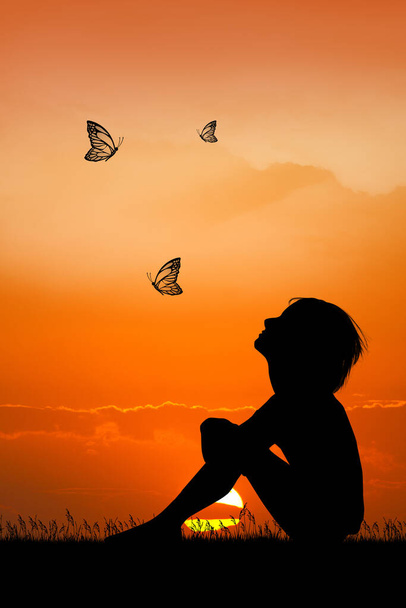 little girl with butterflies at sunset - Фото, зображення