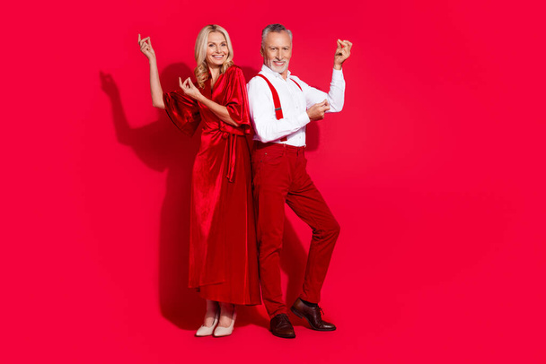 Full size photo of senior boyfriend girlfriend dance tango elegant dress entertainment isolated over red color background - Fotografie, Obrázek