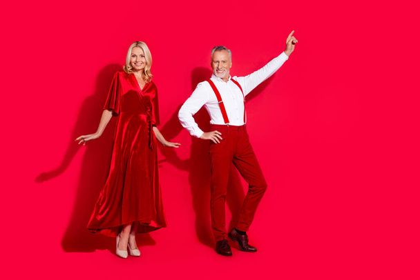 Full size photo of husband and wife partners event retro outfit dancer music disco xmas isolated over red color background - Φωτογραφία, εικόνα
