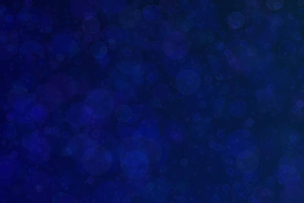 Beautiful abstract deep blue background with circle shaped bokeh patten. - Photo, Image