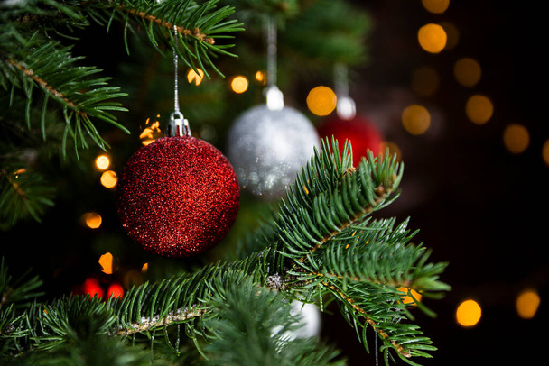 Christmas decoration and ornaments closeup on a Christmas tree. Merry Christmas and Happy New Year - Valokuva, kuva