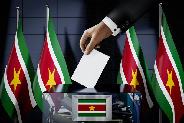 Banderas de Surinam, la mano dejando caer la tarjeta de votación en una caja - votación, concepto electoral - Ilustración 3D - Foto, Imagen