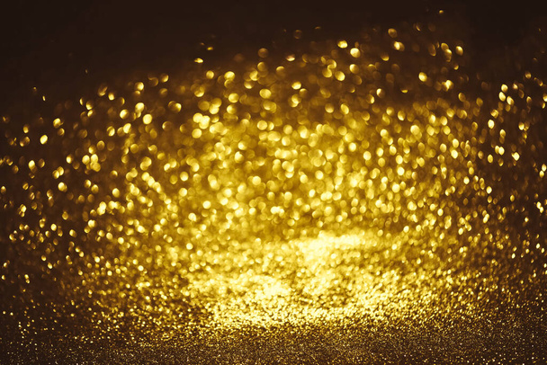 Golden glitter bokeh lighting texture Blurred abstract background for birthday, anniversary, wedding, new year eve or Christmas - Photo, image