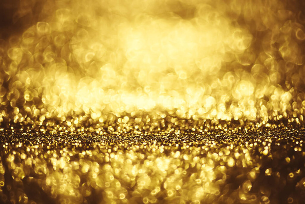 Golden glitter bokeh lighting texture Blurred abstract background for birthday, anniversary, wedding, new year eve or Christmas - Foto, Imagen