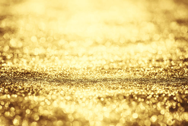 Golden glitter bokeh lighting texture Blurred abstract background for birthday, anniversary, wedding, new year eve or Christmas - Fotoğraf, Görsel