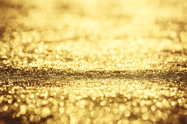 Golden glitter bokeh lighting texture Blurred abstract background for birthday, anniversary, wedding, new year eve or Christmas - Foto, Imagem