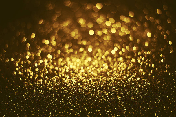 Golden glitter bokeh lighting texture Blurred abstract background for birthday, anniversary, wedding, new year eve or Christmas - Foto, imagen