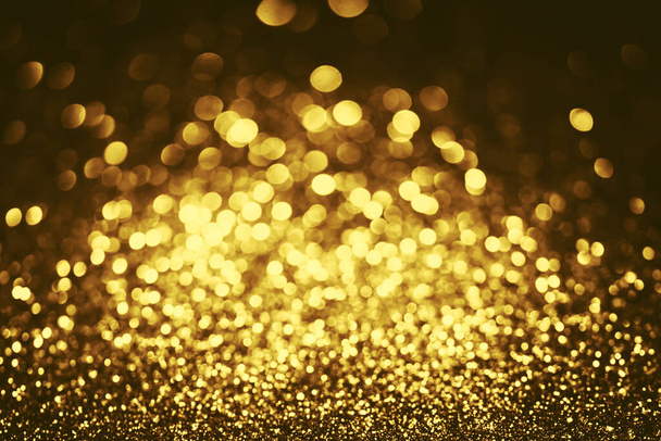 Golden glitter bokeh lighting texture Blurred abstract background for birthday, anniversary, wedding, new year eve or Christmas - Valokuva, kuva