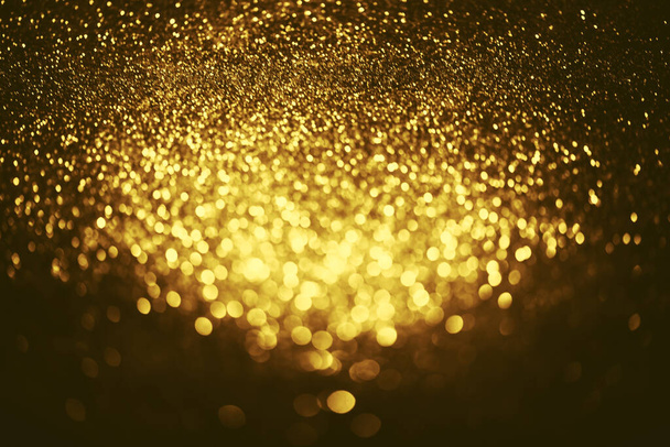 Golden glitter bokeh lighting texture Blurred abstract background for birthday, anniversary, wedding, new year eve or Christmas - Foto, Bild