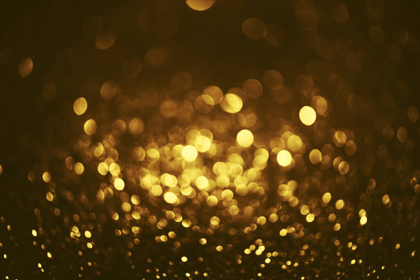 goldener Glitzer Bokeh Beleuchtung Textur verschwommen abstrakten Hintergrund für Geburtstag, Jahrestag, Hochzeit, Silvester oder Weihnachten - Foto, Bild