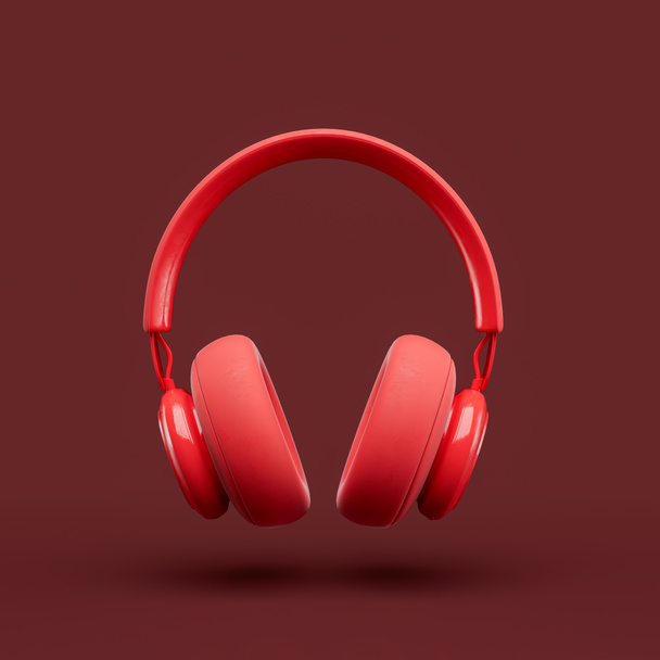 Monochromatyczny pojedynczy czerwony kolor nad słuchawką w czerwonym studio, widok z przodu, renderowanie 3d - Zdjęcie, obraz