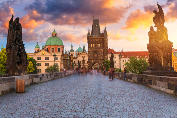 Charles Bridge in Prague in Czechia. Prague, Czech Republic. Charles Bridge (Karluv Most) and Old Town Tower. Vltava River and Charles Bridge. Concept of world travel, sightseeing and tourism. - Foto, Bild