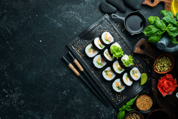 Traditional sushi rolls with tuna and cheese. Japanese cuisine. Top view. - Valokuva, kuva