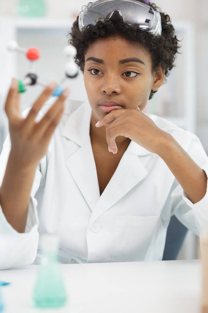 concentrated lab assistant and woman - Photo, Image