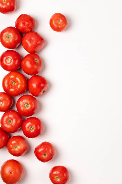 Red fresh tomatoes on a white background space for text - Фото, зображення
