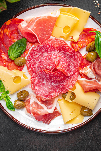 snack plate appetizer meat, sausage, cheese, ham, olives fresh meal on the table copy space food background  - Foto, Imagem