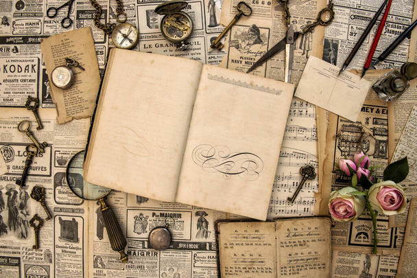 Open book journal diary with vintage accessories and writing tools. Retro style flat lay - 写真・画像