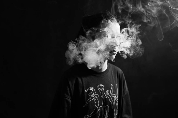 woman smokes, black and white photography - Fotó, kép