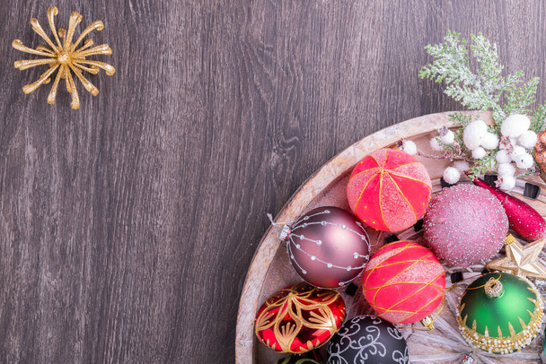 Set of Christmas decorations in wooden tray on grunge background. Holiday concept. Flat lay, top view - Photo, Image