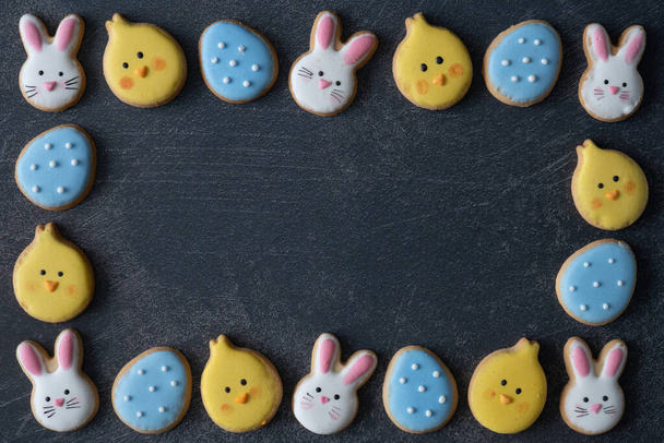 Flat Lay Frame of Easter Cookies from Above with Copy Space on Light Background - Photo, Image
