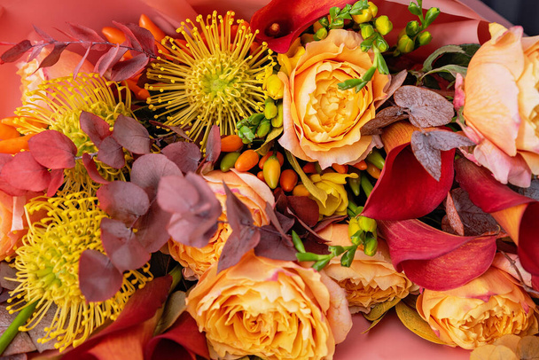 Red pink orange Autumn Colorful fall bouquet. Beautiful flower composition with autumn orange and red flowers. Flower shop and florist design concept. close up, floral background - Foto, immagini